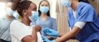 young woman receives vaccine
